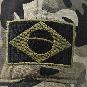 Close-up of Brazilian flag embroidered patch on tactical camouflage baseball cap