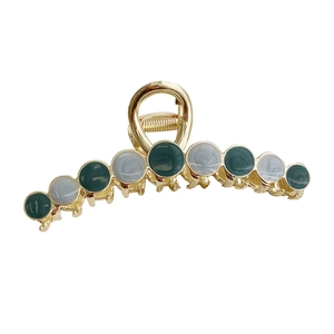 Golden alloy hair claw clip with vintage cat eye stones for elegant hair styling