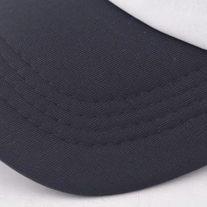 Detailed close-up of the black visor with reinforced stitching on a baseball cap