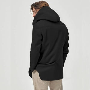 Detail view of the large hood and back tailoring on a black longline men's hooded jacket