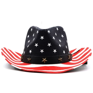Macro detail of USA flag straw cowboy hat with metal star rivets on the hatband