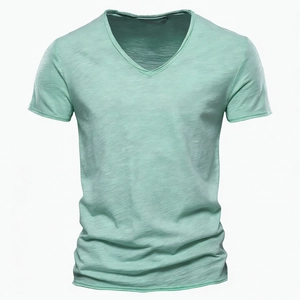 Close-up of mint green V-neck T-shirt showing premium slub cotton texture and fabric detail