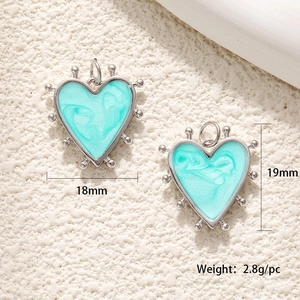 Detail view of heart pendant showing dimensions 18mm by 19mm with marble texture