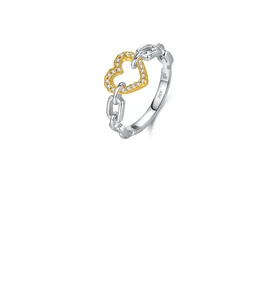 Close-up of S925 sterling silver chain ring with gold-plated heart and pave zircons