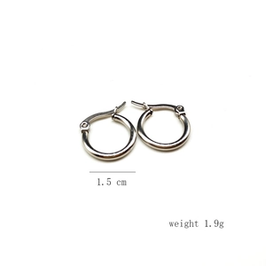 Detailed view of 1.5 cm diameter polished stainless steel hoop earring weighing 1.9g