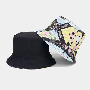 Detail view of double-sided bucket hats featuring vibrant 3D digital geometric prints