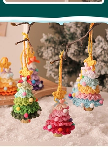 Macro shot of handcrafted crochet Christmas tree ornaments with colorful pom-poms