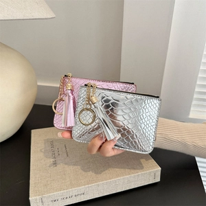 Fashionable pink and silver crocodile pattern coin purses with gold chain and tassel detail