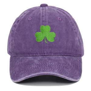 Detail shot of green clover embroidery on vintage purple washed cotton baseball cap