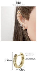 Close-up of gold-plated zircon earring with 10mm inner diameter and 0.9mm pin thickness