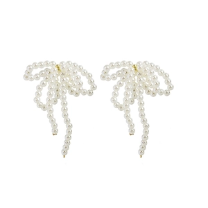 Elegant long tassel pearl earrings with a golden bow design on a white background