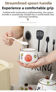 Detailed view of hand-painted floral ceramic seasoning jar with lid and spoon