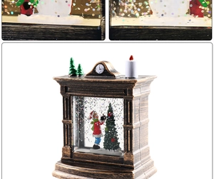 Macro detail of bronze Christmas lantern showing a snowman decorating a tree with snow