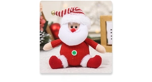 Close-up of knitted Santa Claus ornament with a golden bell on Christmas tree