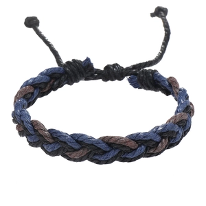 Close-up of adjustable braided rope bracelet in black, dark blue and brown wax cords
