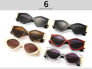 Flat lay of trendy geometric sunglasses in six colors with gold hinge detailing