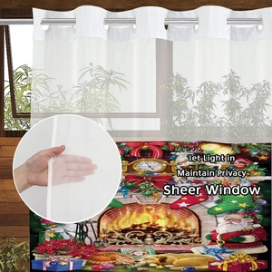 Detail of Christmas advent calendar sheer curtain showing thin fabric and festive print