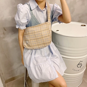 Blue and beige plaid wool crossbody bag styled with a dress for a daily look