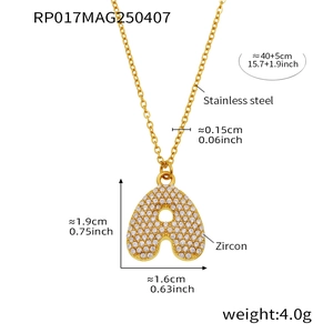 Macro shot of 18K gold plated 'A' letter pendant with zircon and steel chain