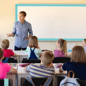 Light blue scalloped bulletin board border stickers shown in classroom setting