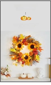 Detail of Halloween wreath with sunflowers, pumpkins, maple leaves and dry branches