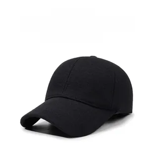 Close-up of winter baseball cap with SPORT metal tag and thick warm fabric texture