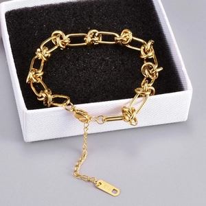 Detail of 18K gold-plated titanium chain bracelet with K18 stamp in jewelry gift box
