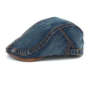 Retro denim flat cap in navy blue with orange stitching and brown contrast brim
