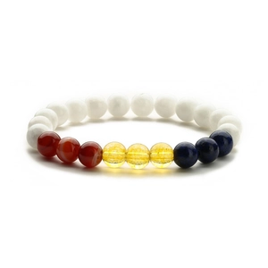 Macro detail of elastic beaded bracelet with tiger eye agate and lapis lazuli stones