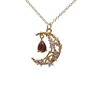 Zircon moon and star necklace with iridescent teardrop pendant on gold chain