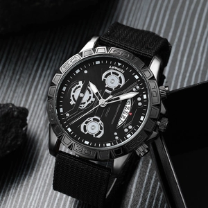 Men's quartz watch with black canvas strap and calendar display on textured stone backdrop