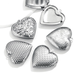 Vintage stainless steel heart locket pendants with intricate floral and tree engravings