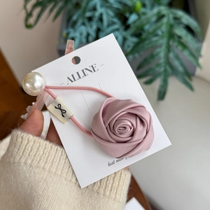 Pink floral satin rose scrunchie with large white faux pearl bead and bow tag detail