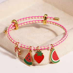 Detail of adjustable braided bracelet with colorful mushroom strawberry and watermelon charms