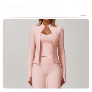 Detail of pink yoga jacket with full zipper, stand collar and functional thumb holes