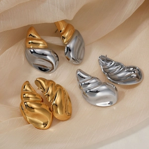 Three pairs of elegant polished stainless steel conch earrings in gold and silver finish