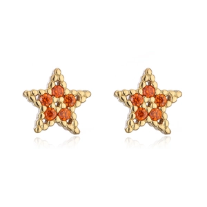 Detailed view of 18K gold plated star stud earrings with vibrant orange zircon stones