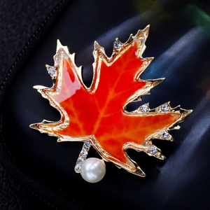Exquisite red maple leaf brooch with gold metal edges and sparkling crystal details