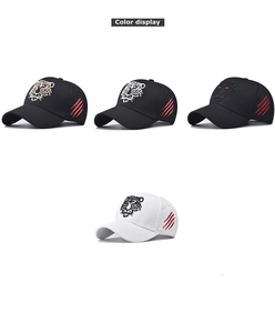 Detail showing high-quality tiger head and red scratch embroidery on cotton baseball caps