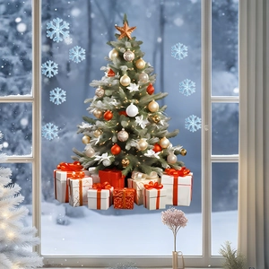 Detail of Christmas tree window clings with snowflakes and gift boxes on glass pane