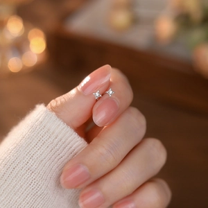 Minimalist S999 sterling silver star stud earrings with sparkling white zircons