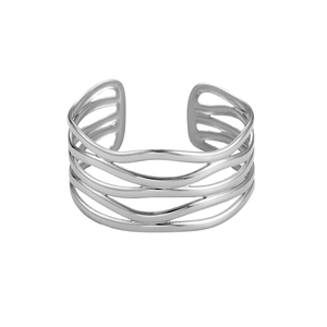 Macro detail of silver multi-layer hollow wave bracelet with polished metal finish