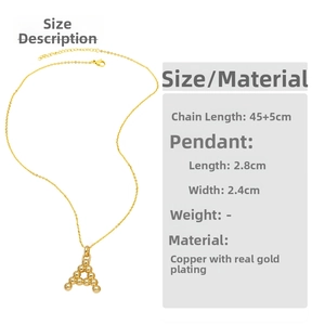 Detailed view of Letter A pendant necklace in gold plated copper with size dimensions