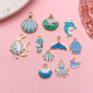 Cute enamel ocean animal pendants including dolphins and octopuses for DIY jewelry making