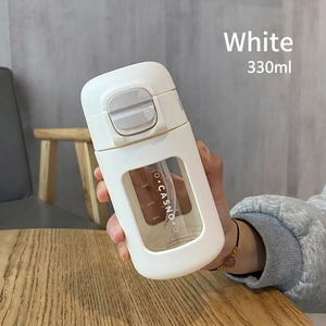 Close-up of a 330ml portable glass coffee cup with matte white shell and clear scale window