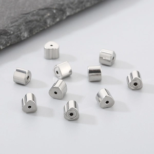Macro view of silver 304 stainless steel heart-shaped DIY earring backs and jewelry components