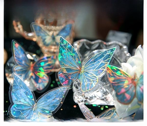 Detailed macro view of iridescent butterfly stickers with holographic gold foil accents