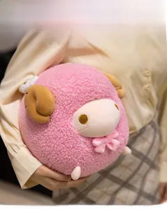 Detailed close-up of a pink sheep plush toy with soft sherpa fleece and cute horns