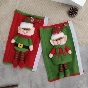 Christmas elf refrigerator handle covers in festive red and green with 3D dolls