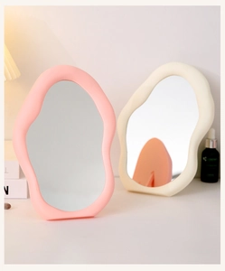 Irregular cloud-shaped makeup mirrors in pink and cream frames for desktop decor